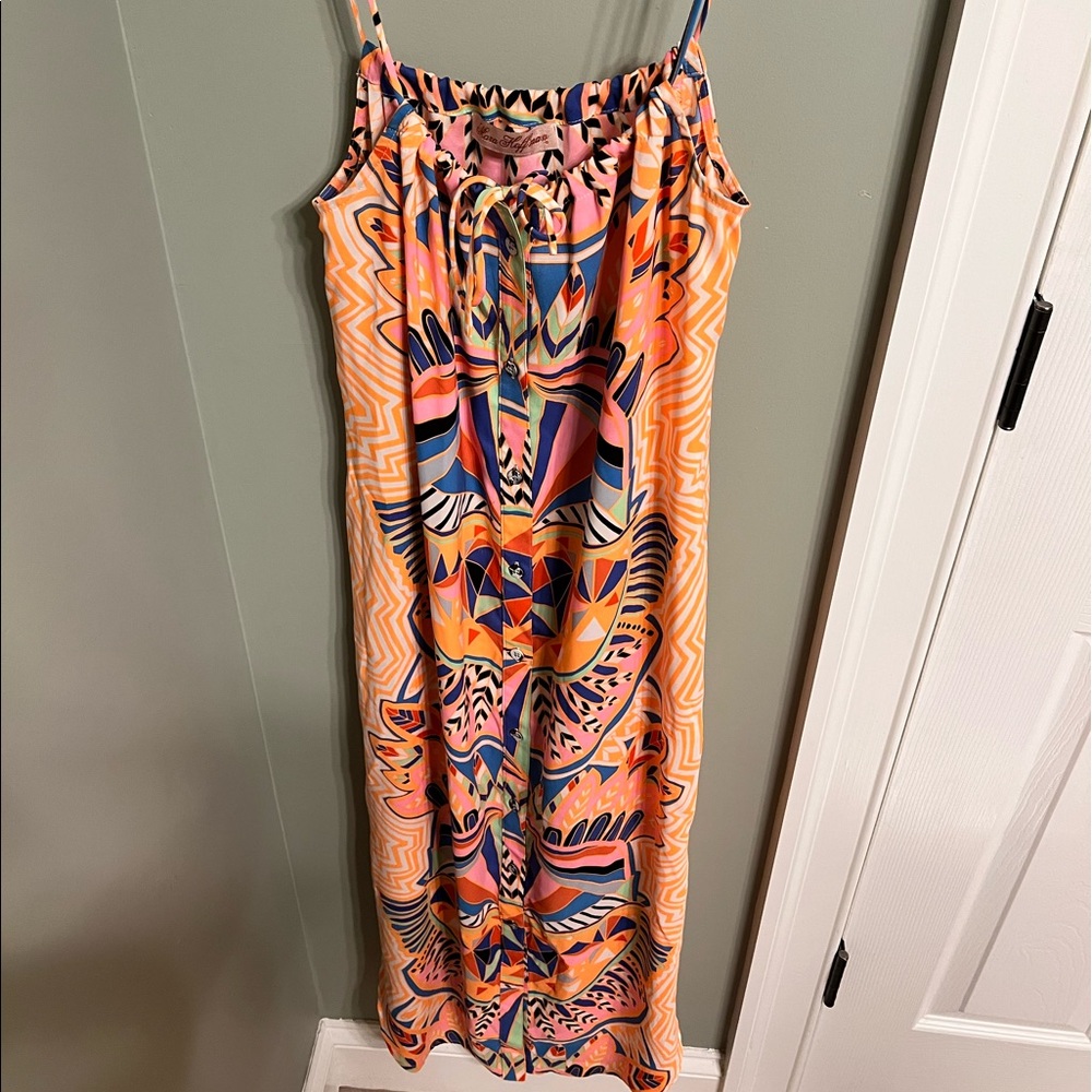 Mara Hoffman orange midi dress with buttons down the front and tie at chest.